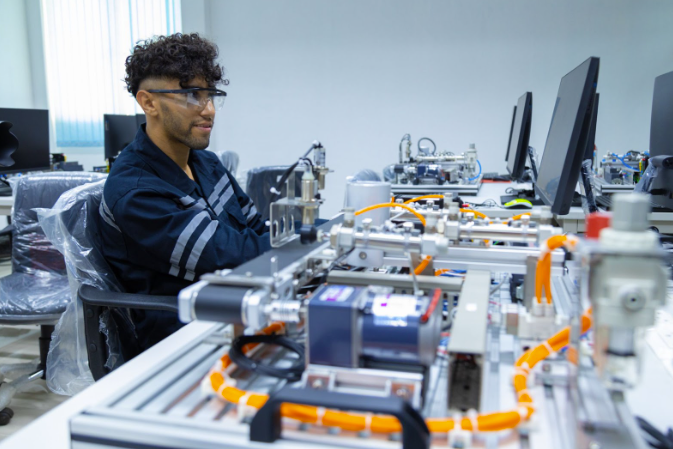 Technician working on robotics components