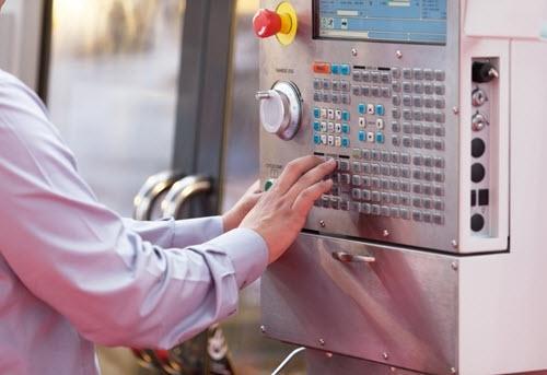 Employee working on a PLC