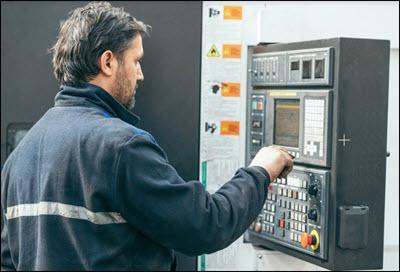Man working at a programmable machine
