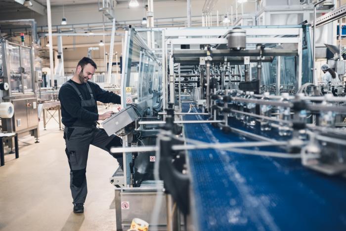 Man working on a PLC machine