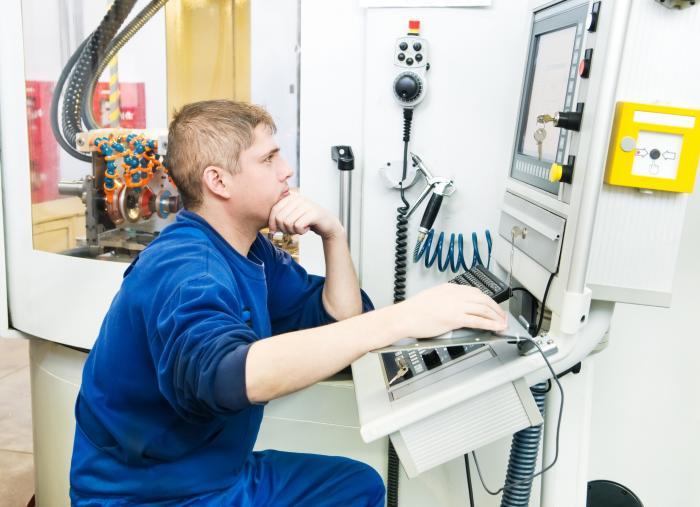 Technician working with PLC computer