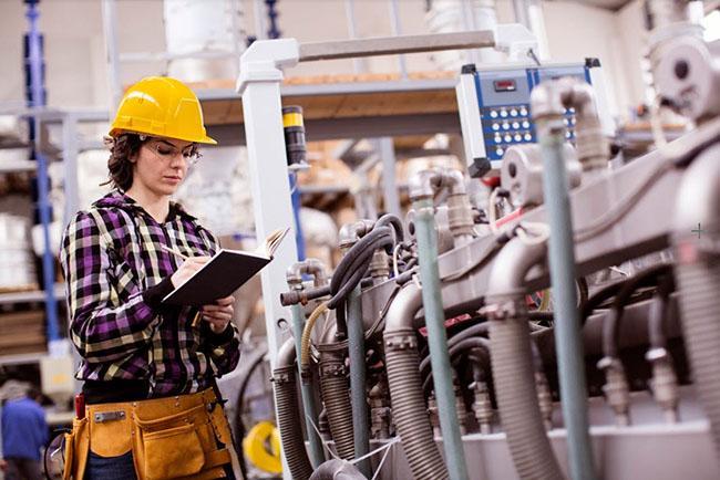 Employee working on a PLC