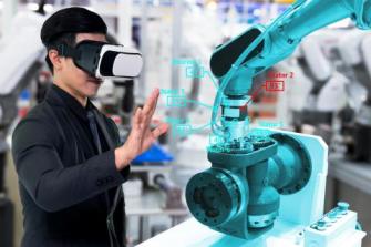 man wearing vr glasses in front of robotic arm