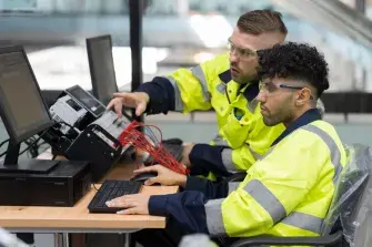 engineers using desktop training PLC